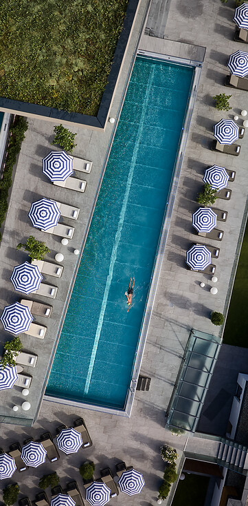 Sports pool and infinity pool photographed from above using a drone