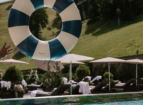 Blue and white striped swimming ring in the Family Friendly Hotel with Pool